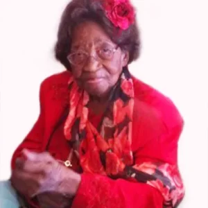 Mom, Lenora Davis, in red coat with a red rose in her hair